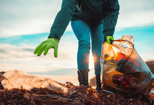 Woman picking up waste